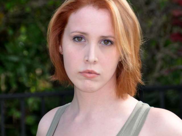 A close outdoor portrait of Dylan Farrow adult.